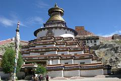
Commissioned by a Gyantse prince in 1270, the Kumbum chorten was built in the style of a 108-sided mandala by craftsman from the Kathmandu Valley, and houses many excellent unique frescoes of Newari influence, a painting style originating in Nepal's Kathmandu Valley. It rises in eight stages to over 52m and has lots of images (Kumbum means '100,000 images') and 70 chapels. It is topped in typical Nepalese Buddhist style with the all-seeing eyes, the spire, umbrella and the pinnacle. The first five floors are four-sided, while the upper floors are circular, forming a huge three-dimensional mandala.
